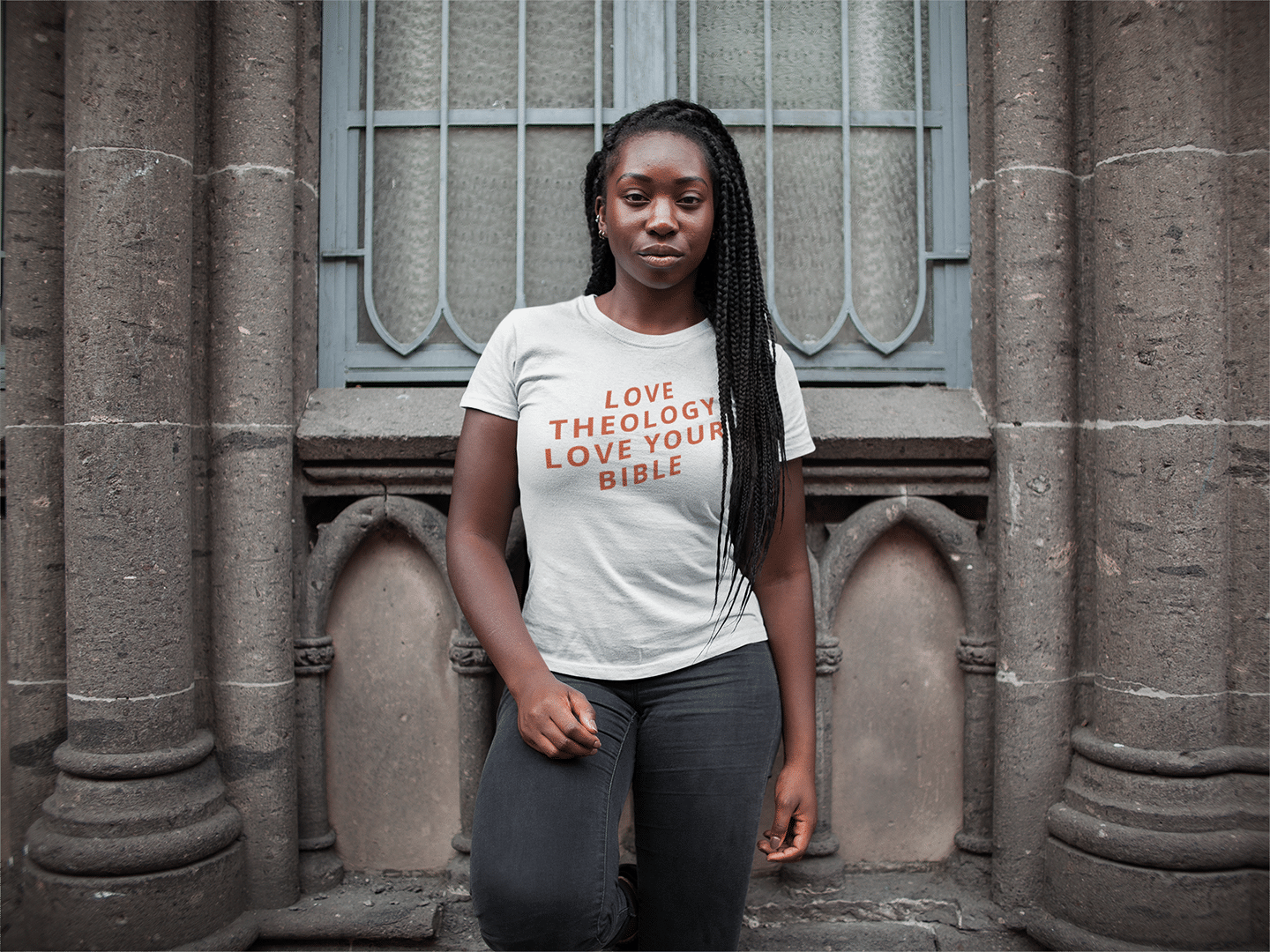 mockup-of-a-woman-with-braids-wearing-a-t-shirt-mockup-while-outside-a-church-a15953