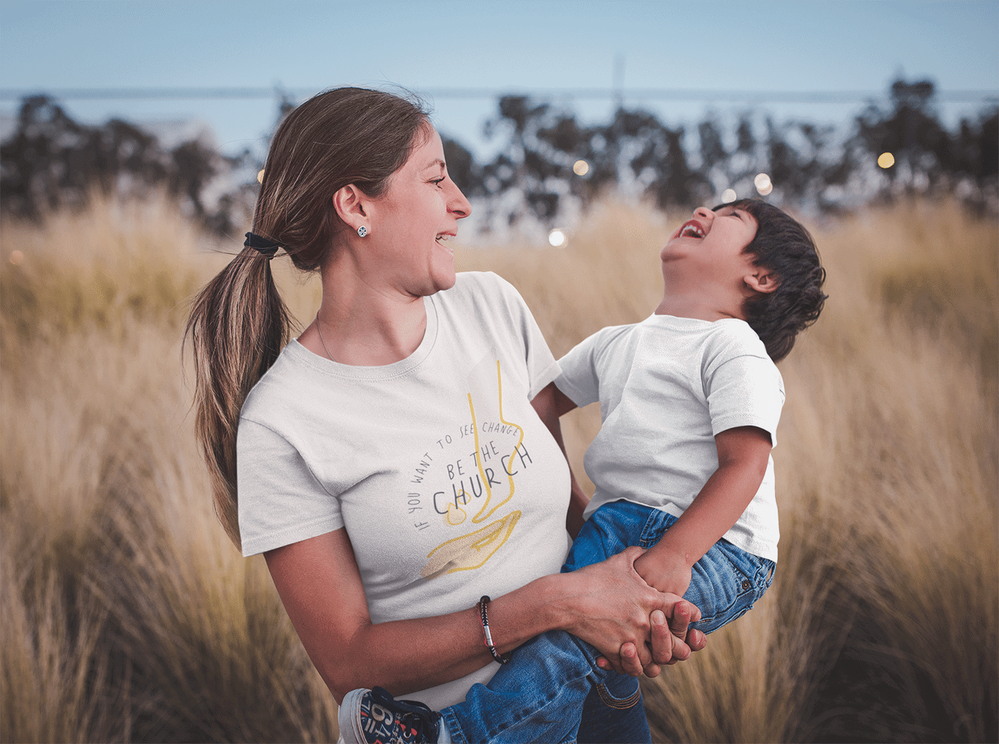 mom-and-son-wearing-t-shirts-mockup-outdoors-while-having-fun-a20203